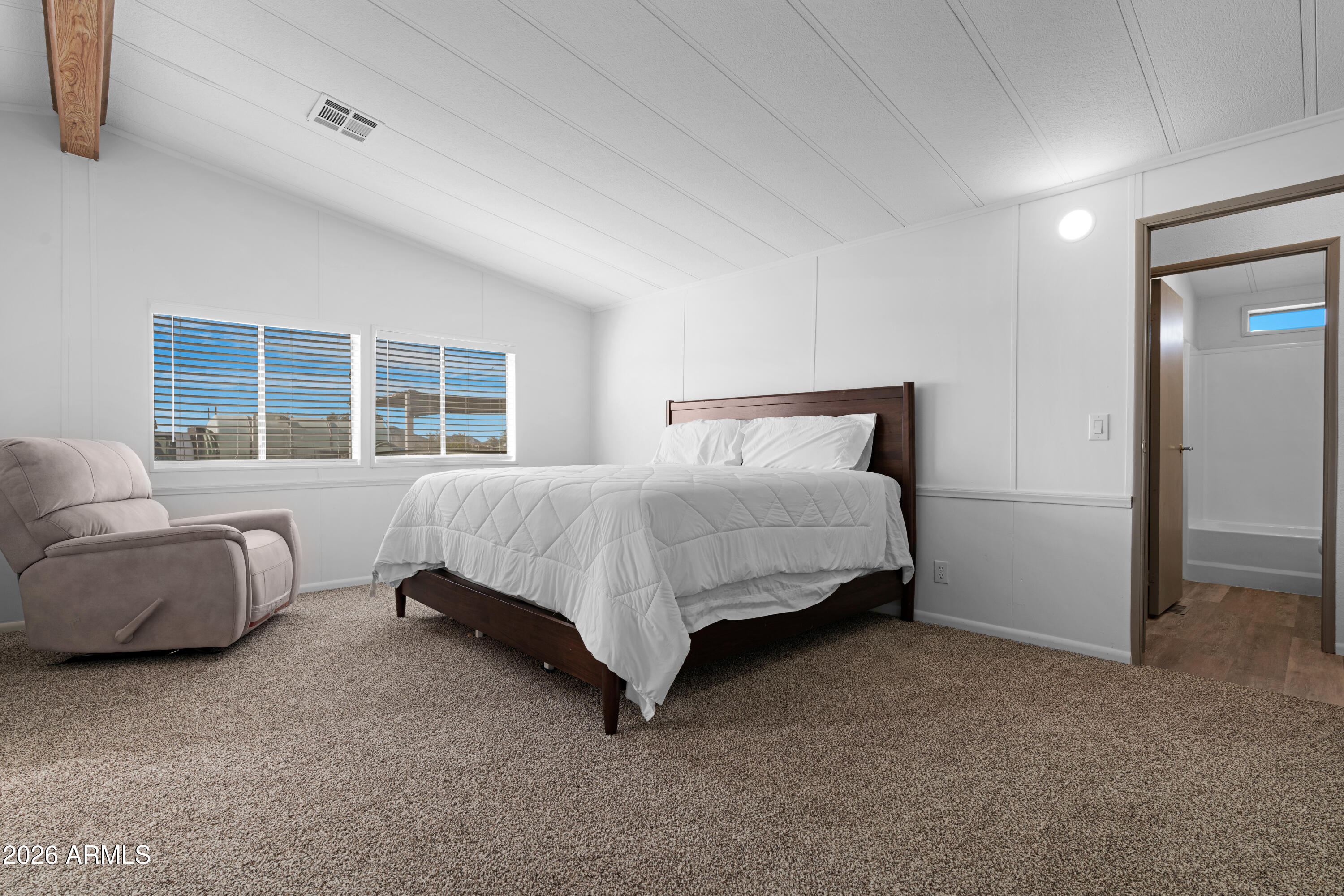 53925 West Stallion Road Maricopa, AZ 85139 - Photo 19 of 46 a bedroom with a bed and window