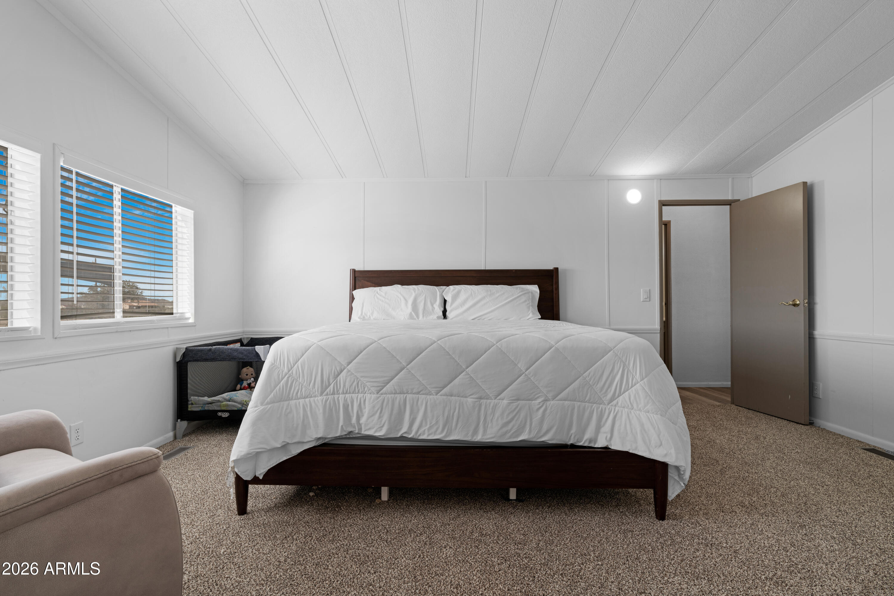 53925 West Stallion Road Maricopa, AZ 85139 - Photo 20 of 46 a bedroom with a bed and window