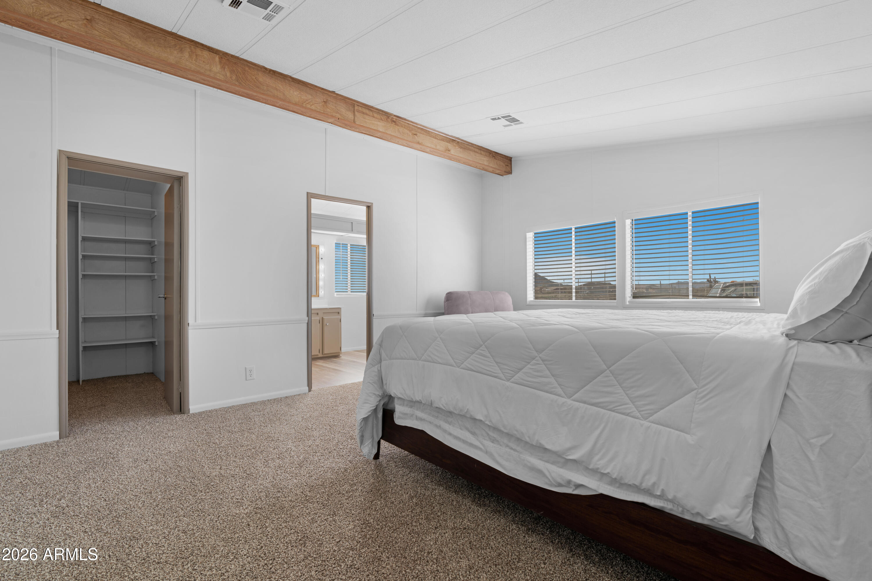 53925 West Stallion Road Maricopa, AZ 85139 - Photo 21 of 46 a bedroom with a bed and a window