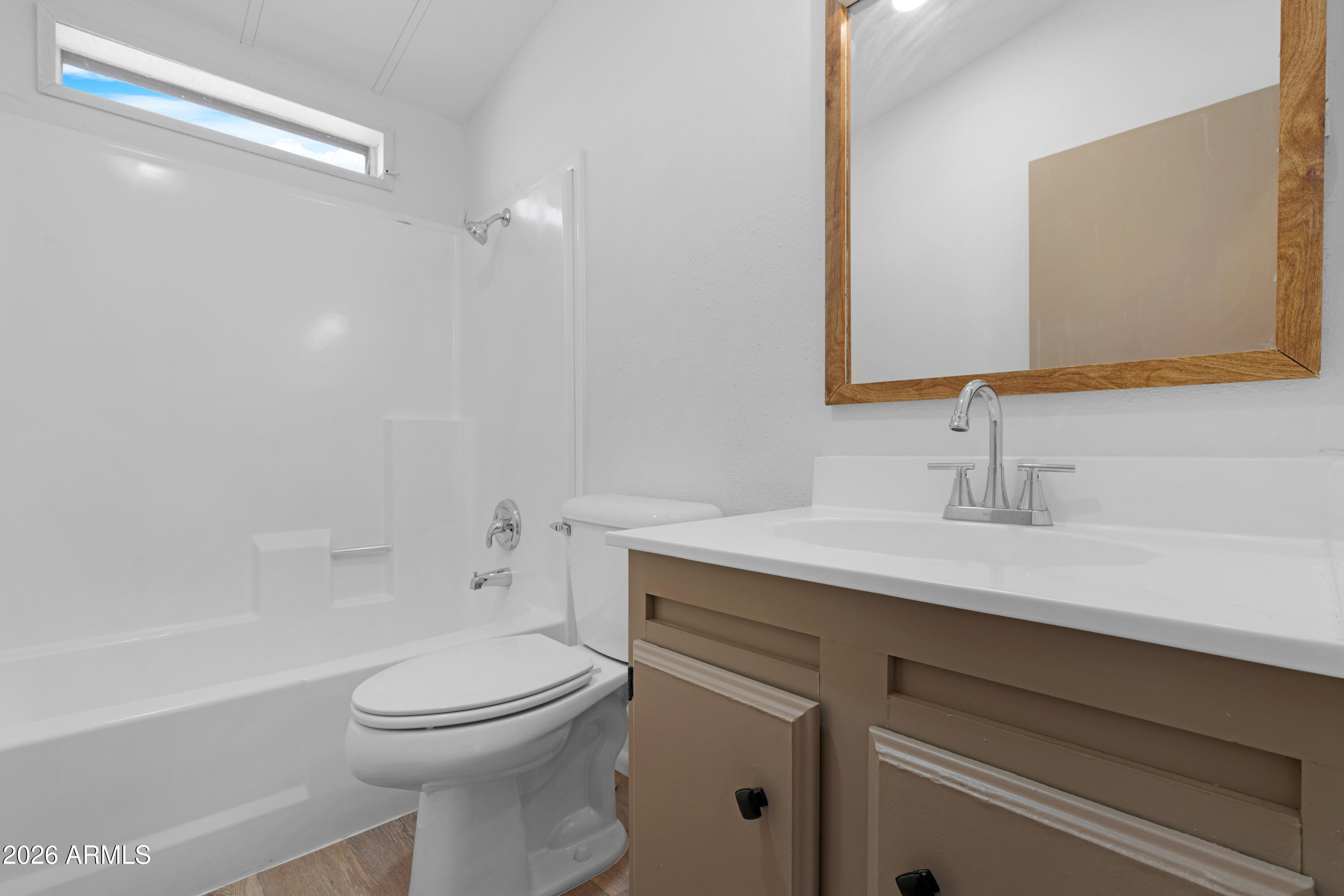 53925 West Stallion Road Maricopa, AZ 85139 - Photo 28 of 46 a bathroom with a sink a toilet and shower