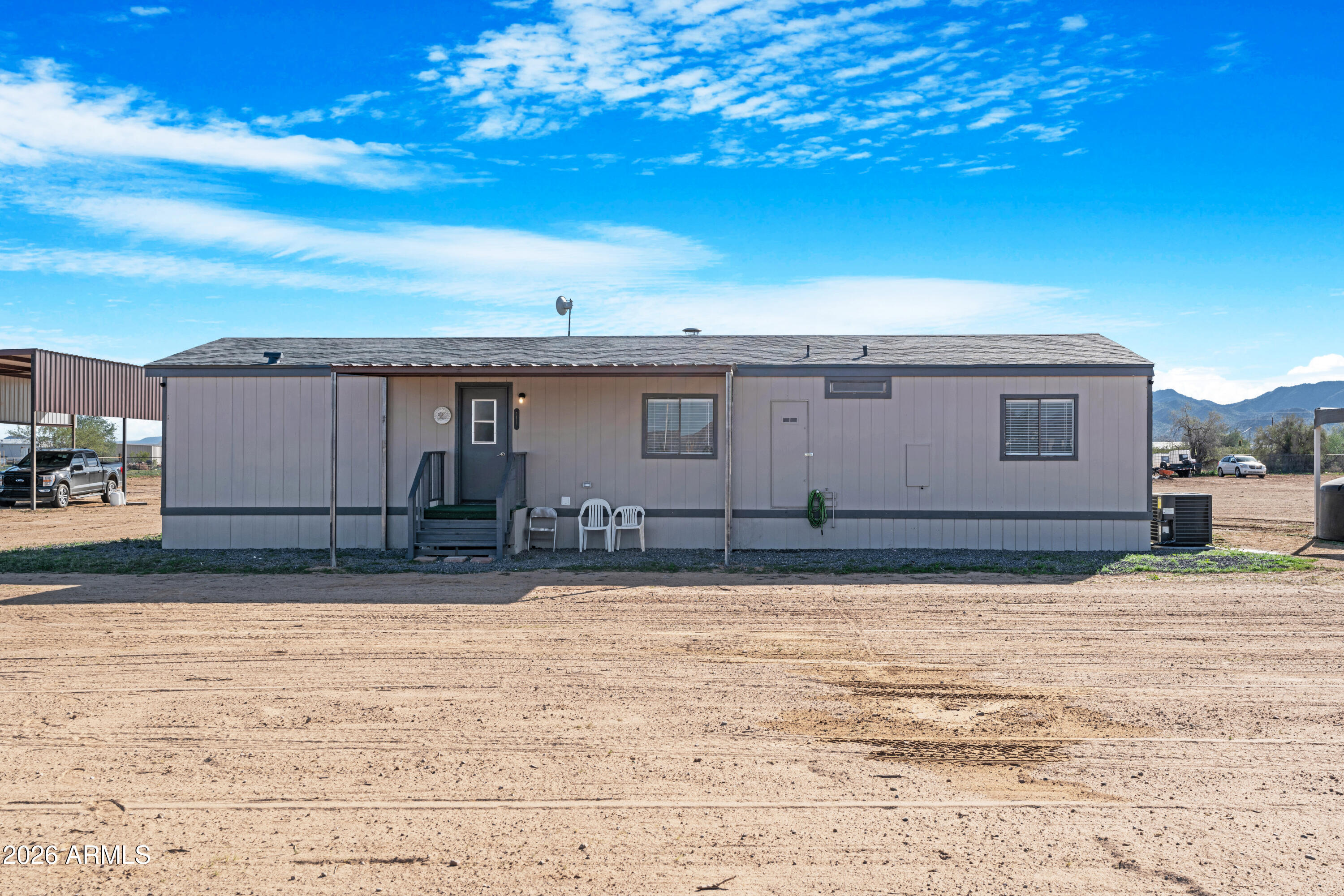 53925 West Stallion Road Maricopa, AZ 85139 - Photo 3 of 46 a house view with a backyard space