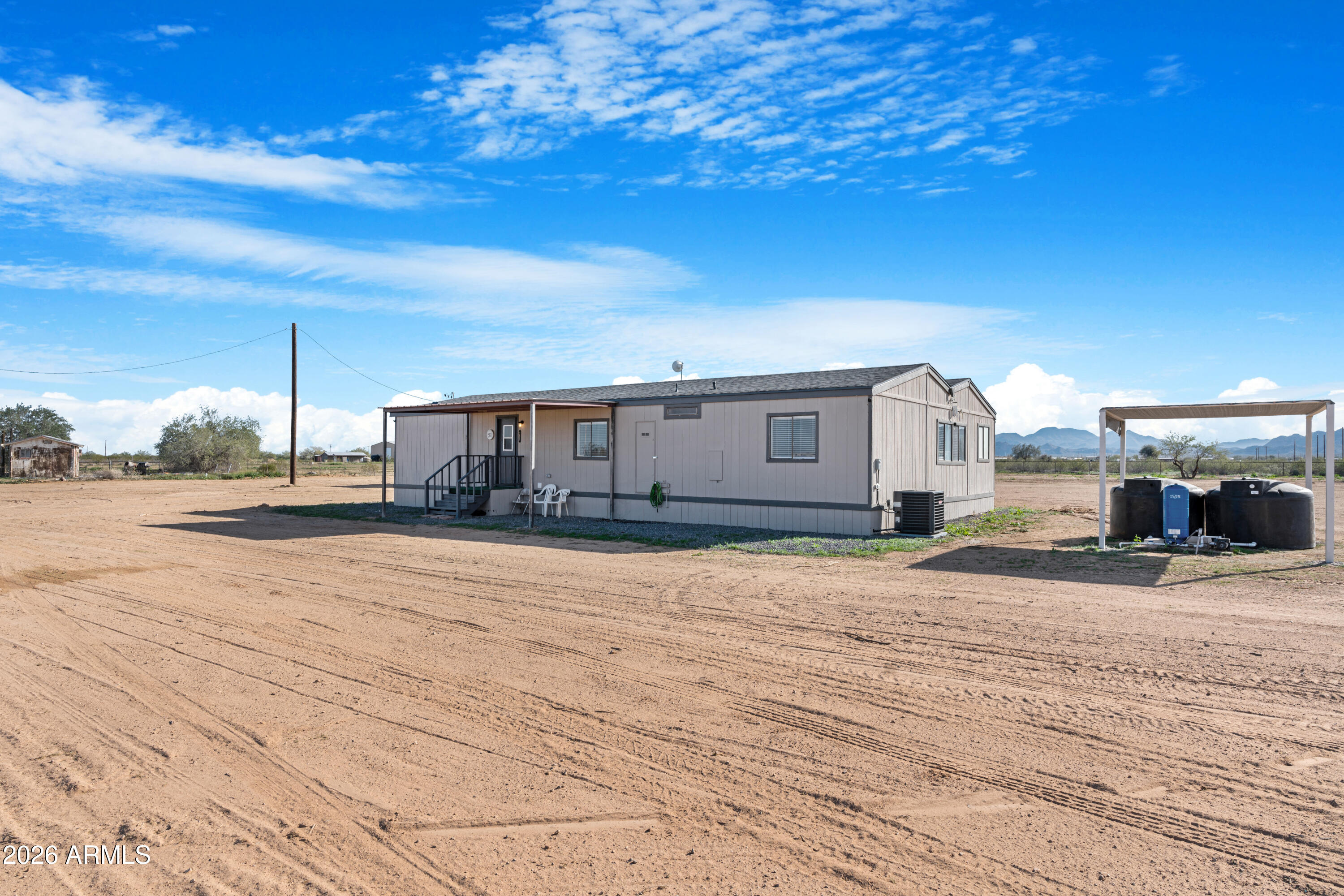 53925 West Stallion Road Maricopa, AZ 85139 - Photo 4 of 46 a view of a house with a patio