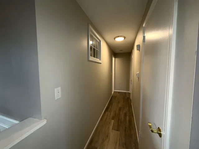 a kitchen with granite countertop a refrigerator stove and sink