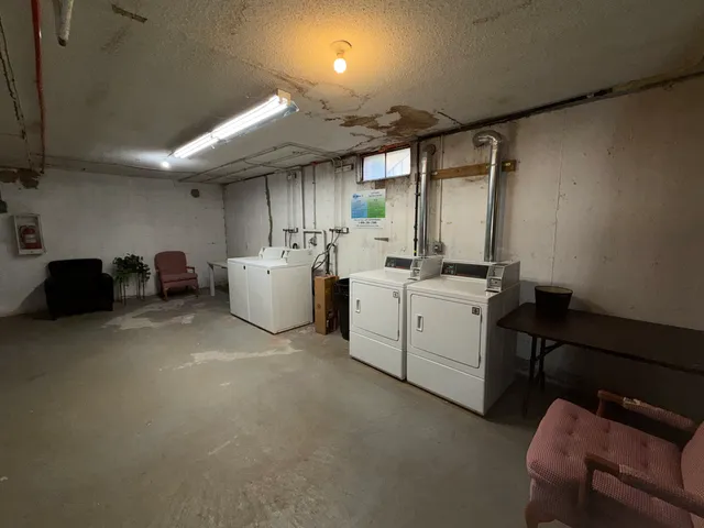 a utility room with cabinets