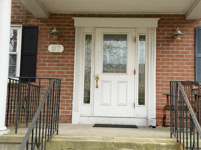 a view of a brick house with wooden floor