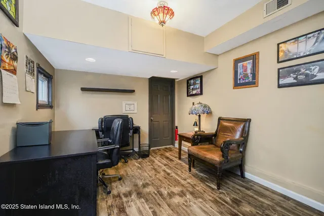 a kitchen with a refrigerator sink and cabinets