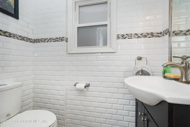 a kitchen with a microwave stove top oven and sink