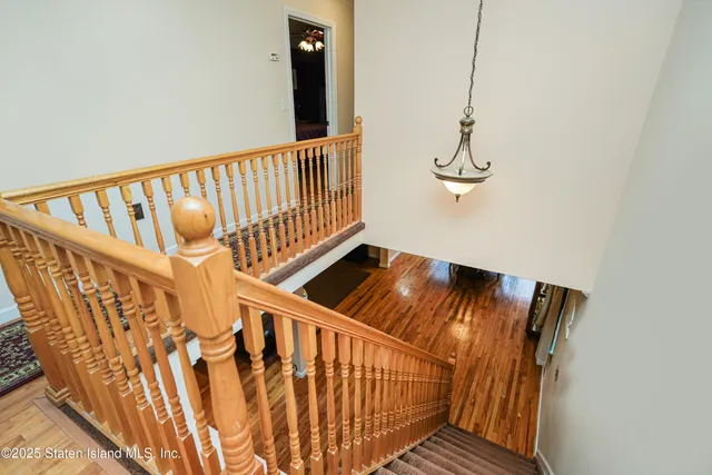 a bathroom with a tub sink and glass door