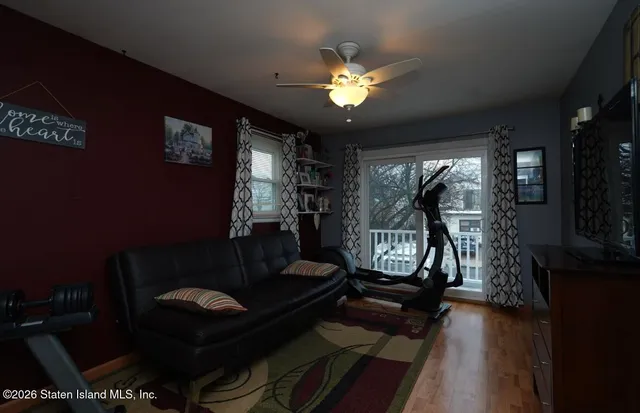 a room with furniture pool table and windows