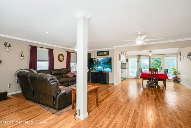 a view of a dining room with furniture and wooden floor