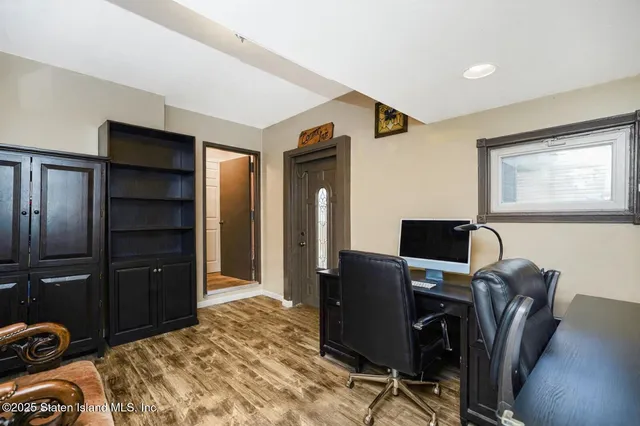 a kitchen with stainless steel appliances granite countertop a stove top oven a refrigerator and white cabinets