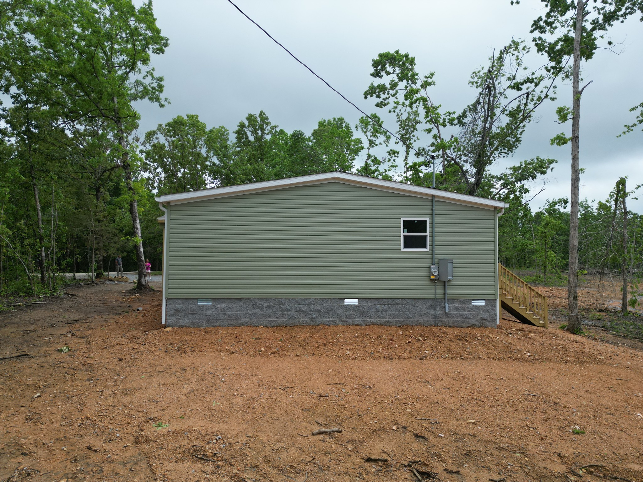 467 Woodland Road Hohenwald, TN 38462 - Photo 19 of 20 a view of a house with a backyard