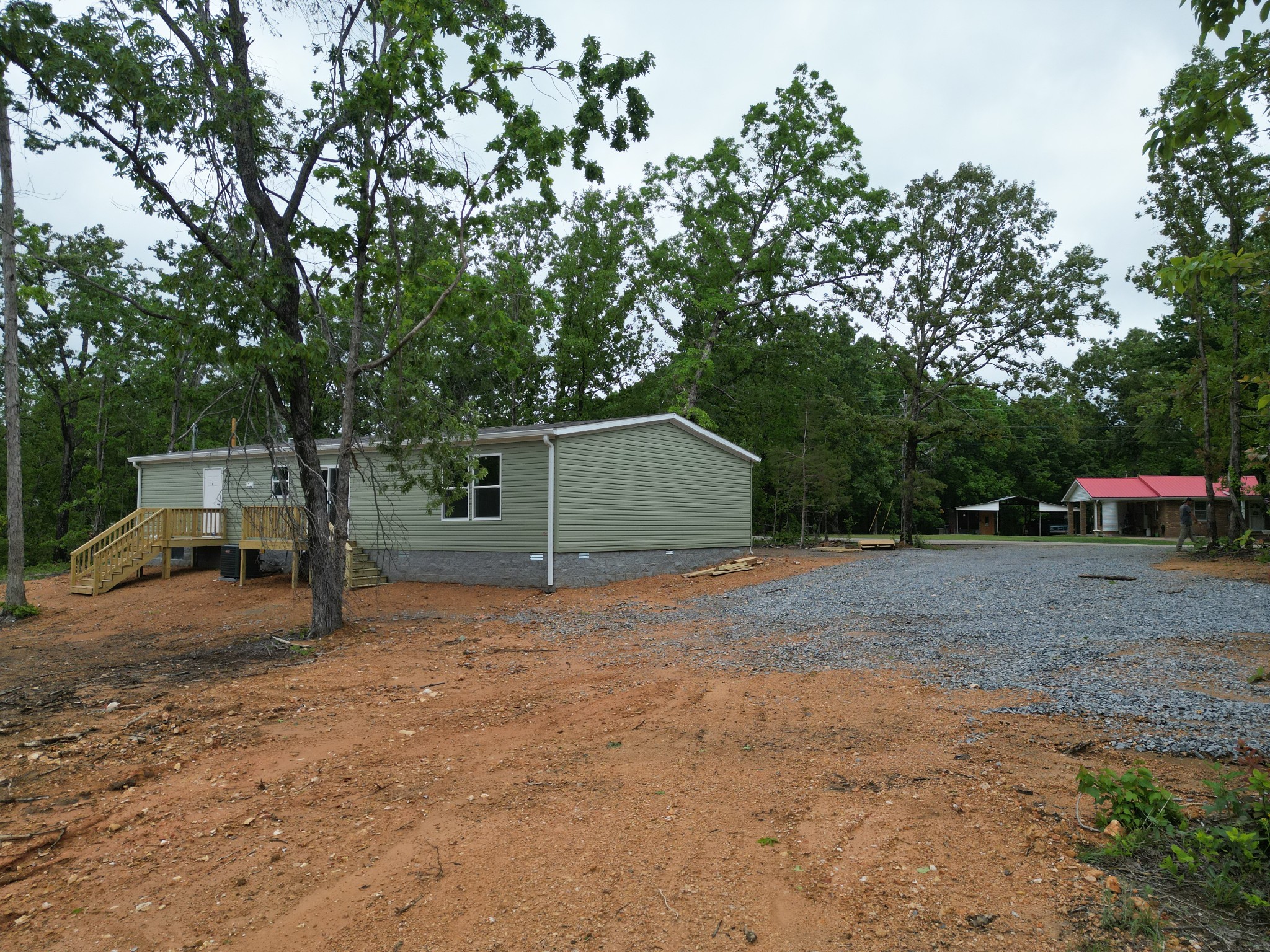 467 Woodland Road Hohenwald, TN 38462 - Photo 20 of 20 a house with trees in the background