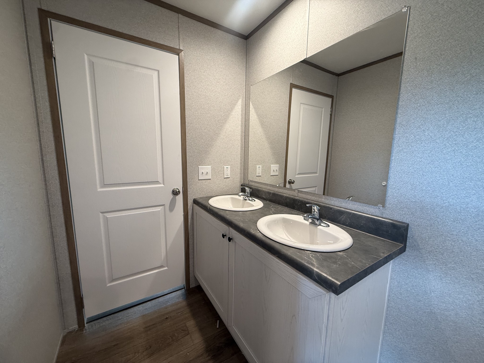 467 Woodland Road Hohenwald, TN 38462 - Photo 10 of 20 a bathroom with a granite countertop sink and a mirror