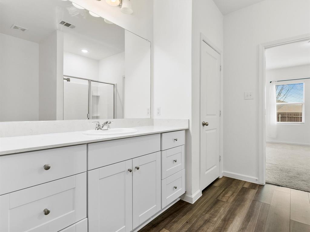 13344 Ridings Drive Fort Worth, TX 76052 - Photo 25 of 29 a bathroom with a double vanity sink and mirror