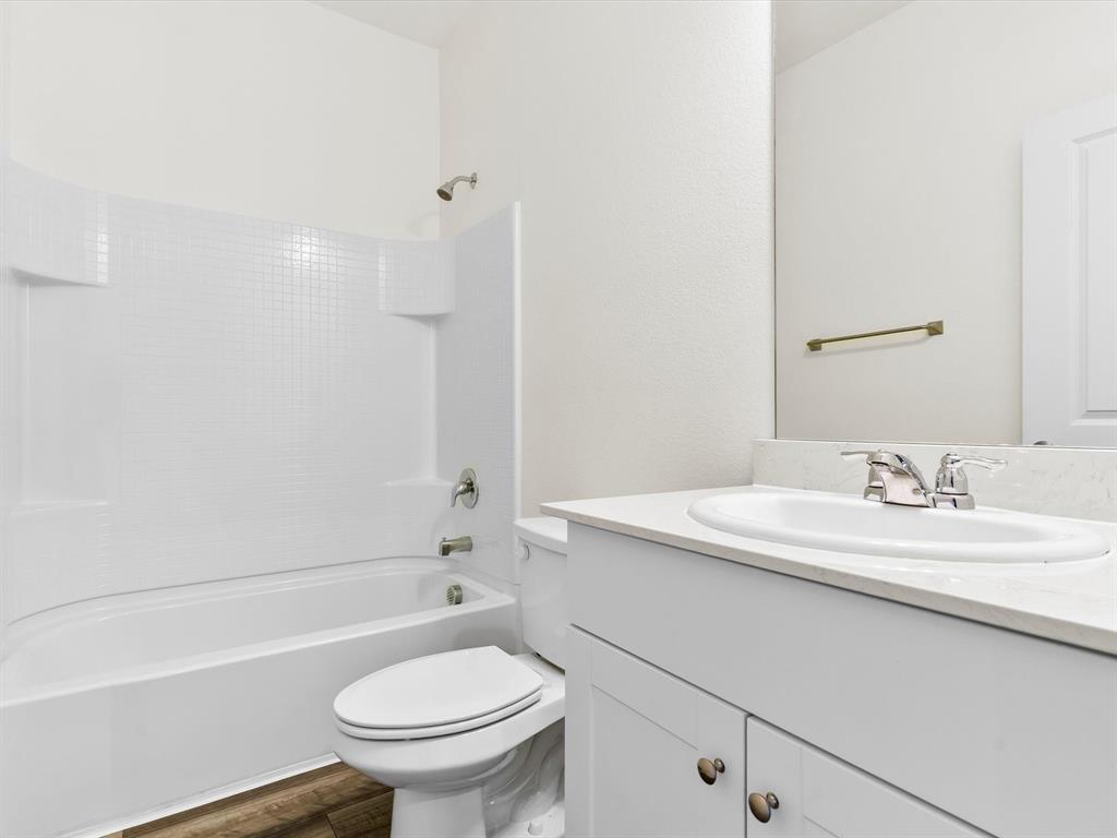 13344 Ridings Drive Fort Worth, TX 76052 - Photo 8 of 29 a bathroom with a sink a toilet and shower