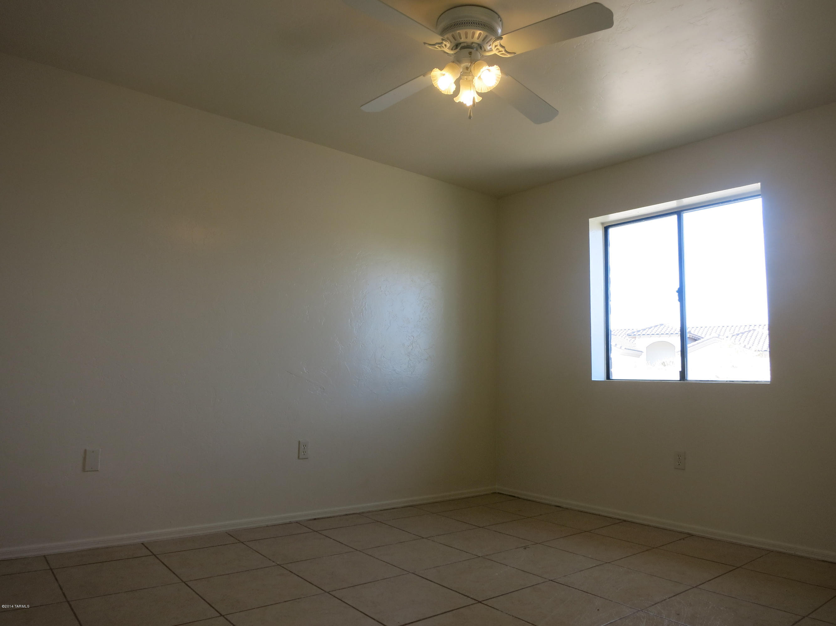 1055 Ameca Court Rio Rico, AZ 85648 - Photo 12 of 18 an empty room with a window