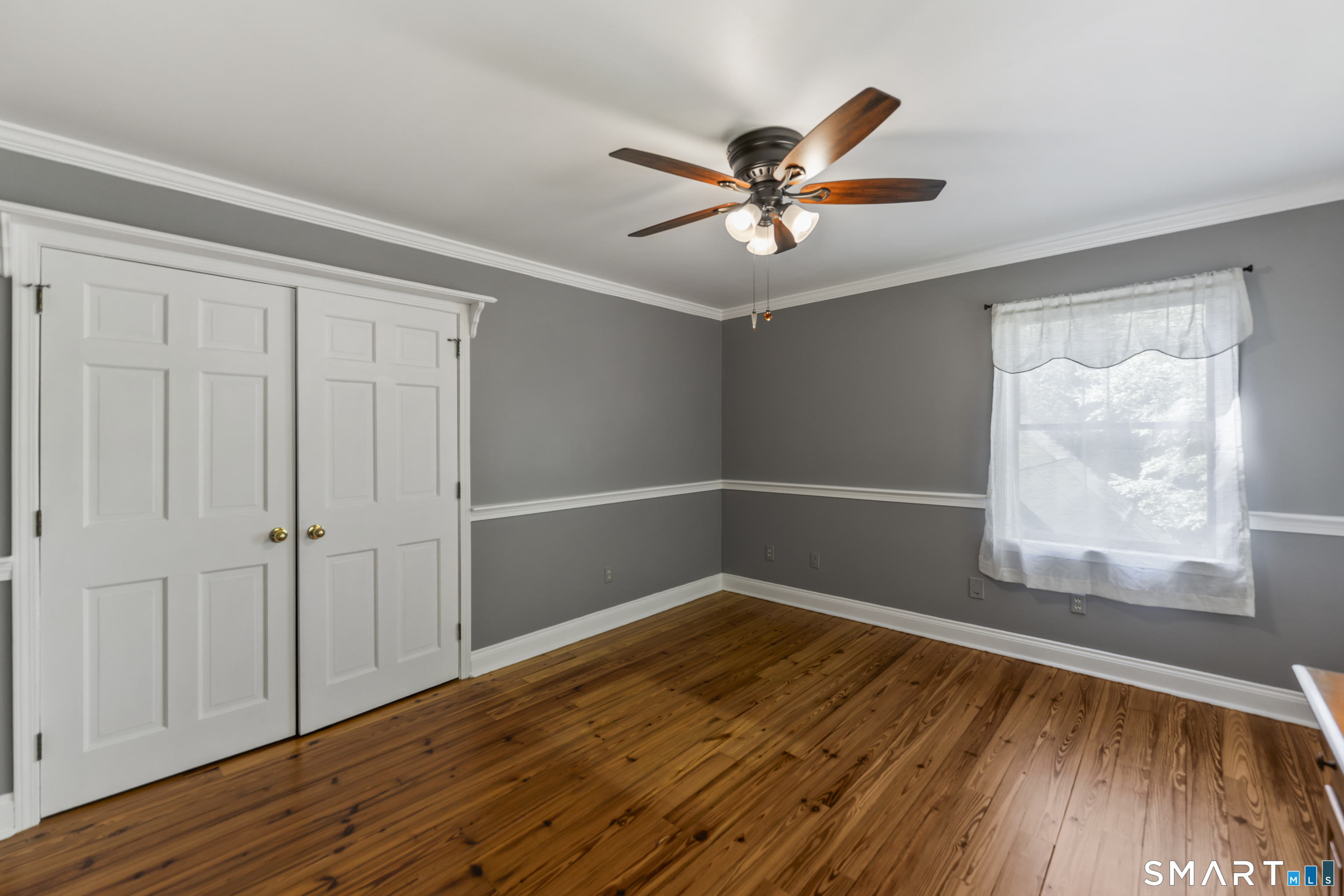 18 Gelding Hill Road Newtown, CT 06482 - Photo 29 of 40 an empty room with wooden floor fan and windows