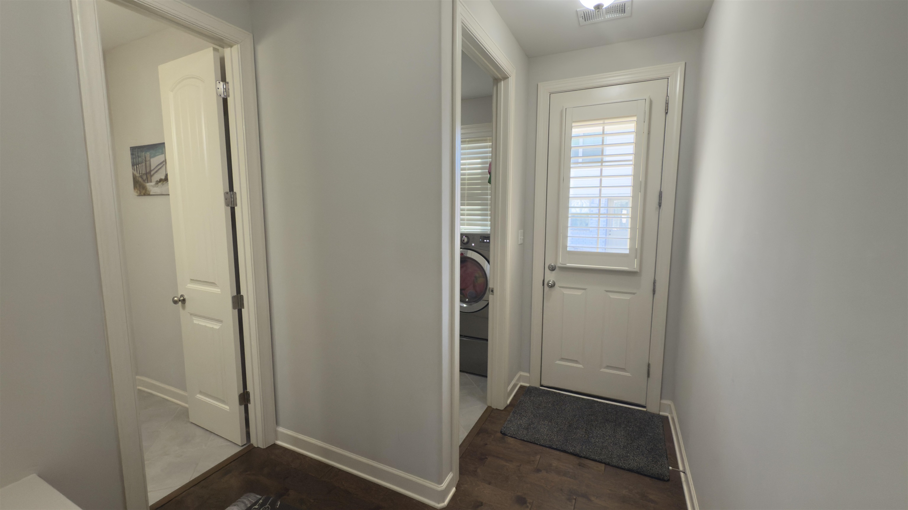 1217 Pilgrim Ridge Road Collierville, TN 38017 - Photo 12 of 33 Entryway featuring washer / dryer and wood finished floors