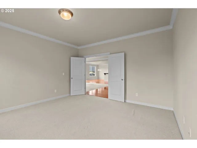 a view of a house with a wooden deck