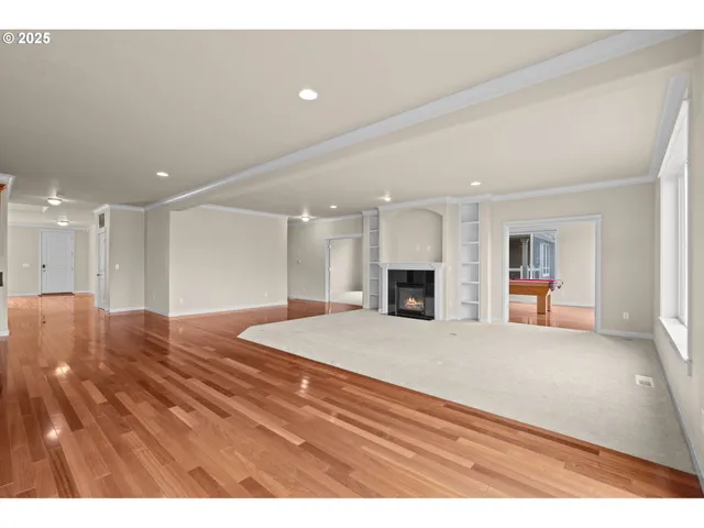 a living room with furniture a table and a fireplace