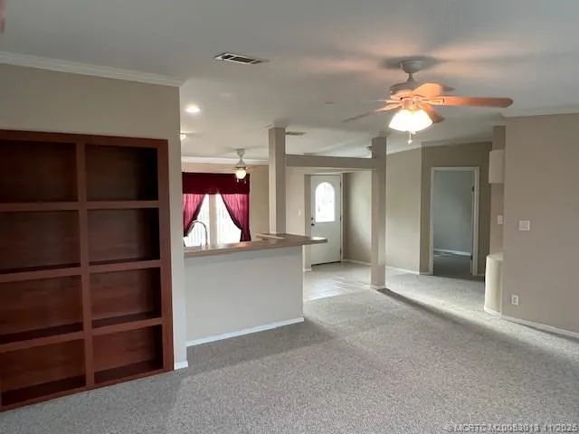 a kitchen with a sink stove and microwave