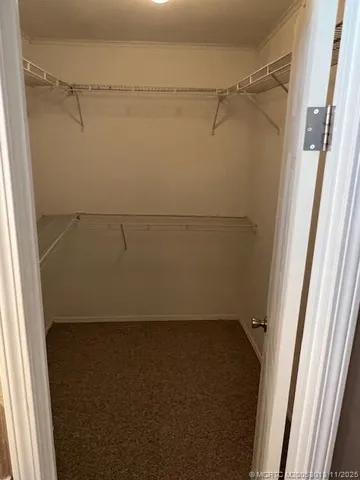 a bathroom with a granite countertop shower and a sink