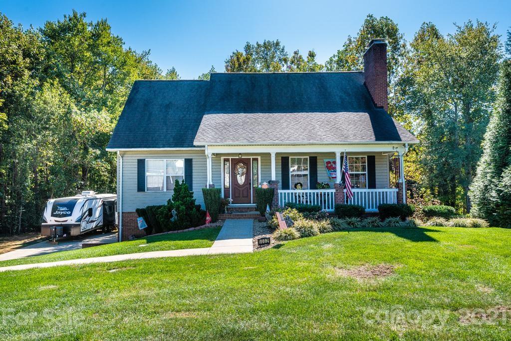 a front view of a house with a yard table and chairs