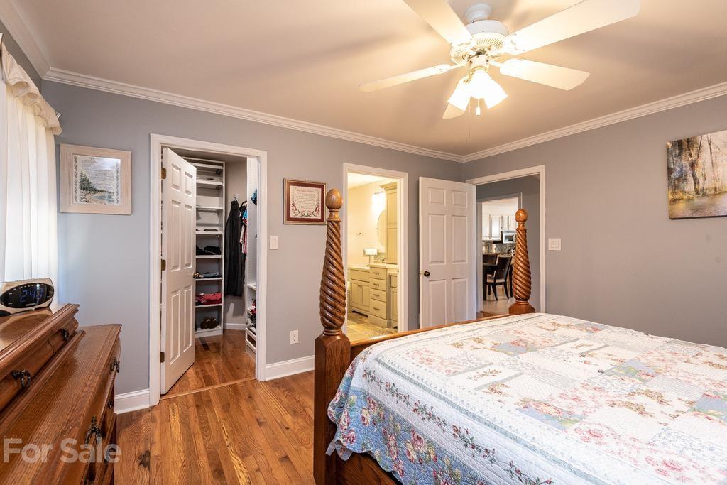 1002 4th Street Northeast Conover, NC 28613 - Photo 21 of 41 a bed room with a bed and a chandelier