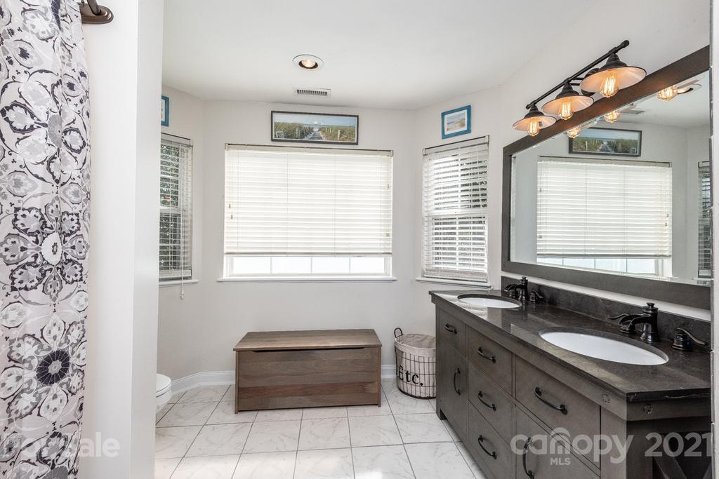 1002 4th Street Northeast Conover, NC 28613 - Photo 26 of 41 a bathroom with a sink and a bathtub