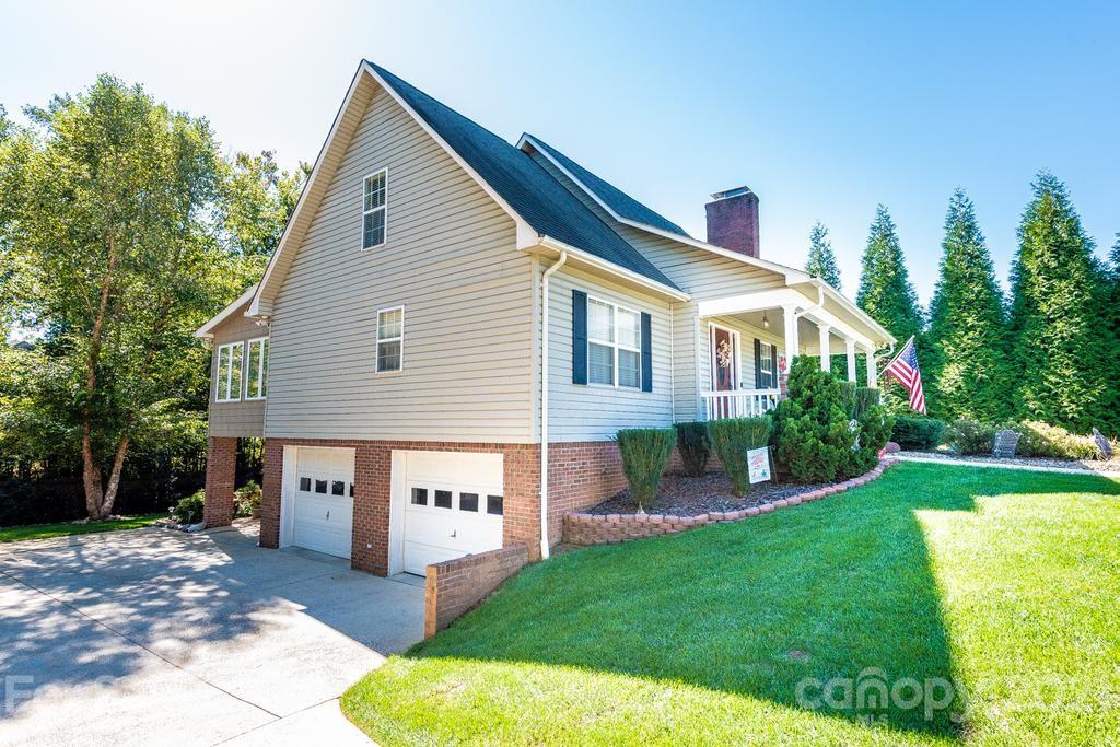 1002 4th Street Northeast Conover, NC 28613 - Photo 35 of 41 a view of a house with a yard and a garden