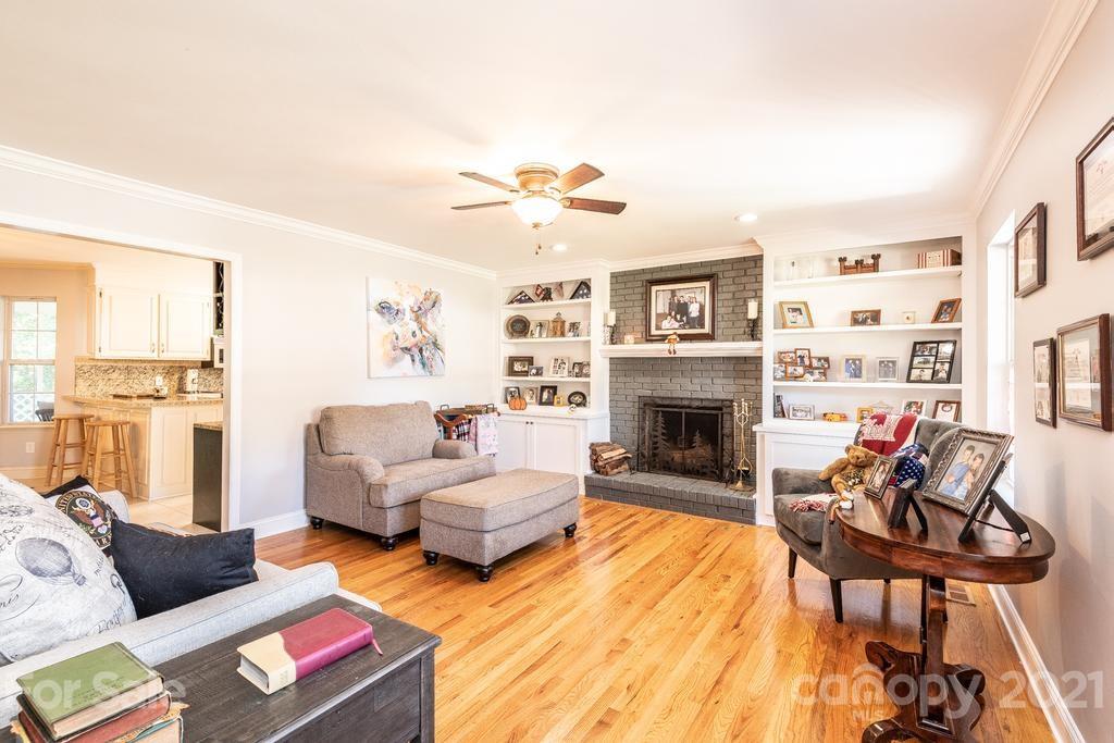 1002 4th Street Northeast Conover, NC 28613 - Photo 8 of 41 a living room with furniture and a fireplace