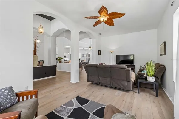 a living room with furniture and a large window