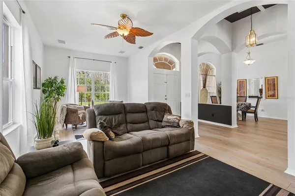 a view of a dining room with furniture window and wooden floor