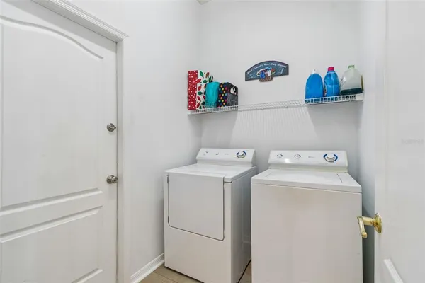 a living room with a fireplace and a space