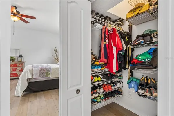 a kitchen with white cabinets and sink