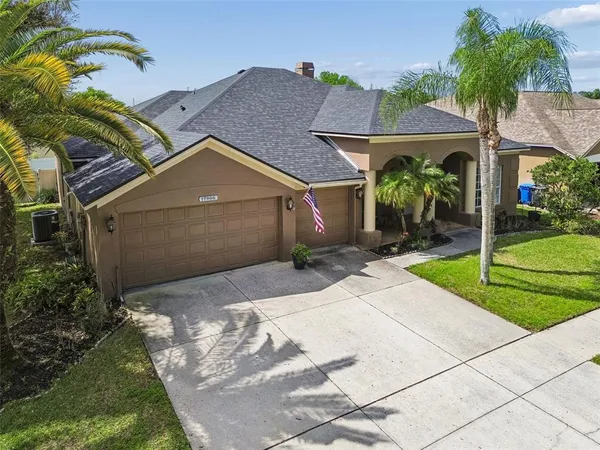 a front view of house with yard and green space
