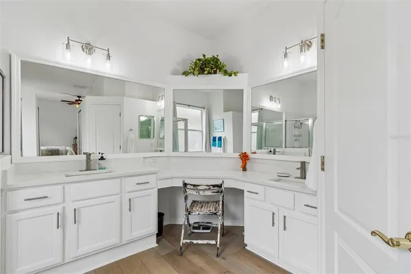 a bedroom with a bed and a chair with the view of bathroom