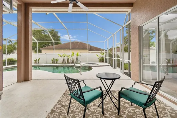 an aerial view of residential houses with outdoor space and river