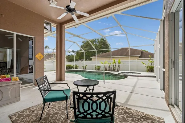 an aerial view of residential houses with outdoor space and a lake view