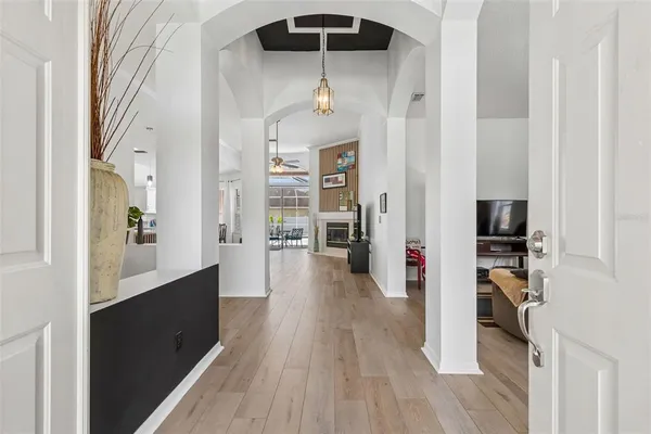 a view of a hallway view with wooden floor and staircase