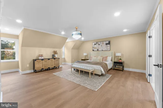 a spacious bedroom with a bed and window