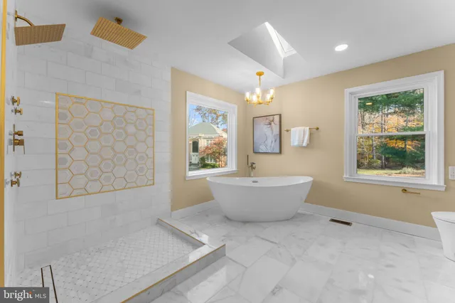 a white bath tub sitting next to a window