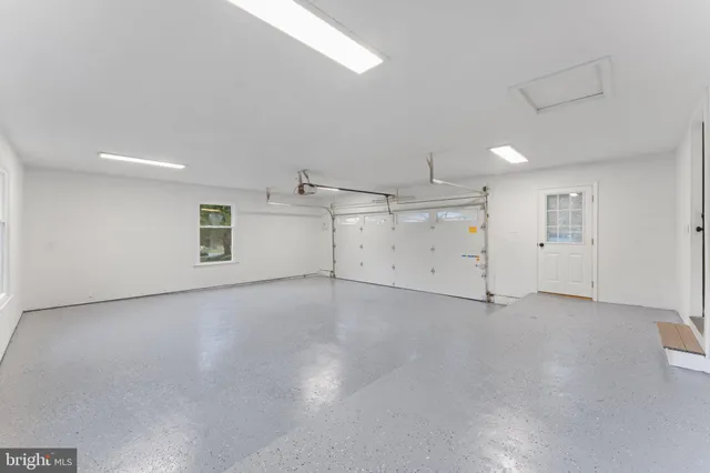 a view of a house with a yard and garage