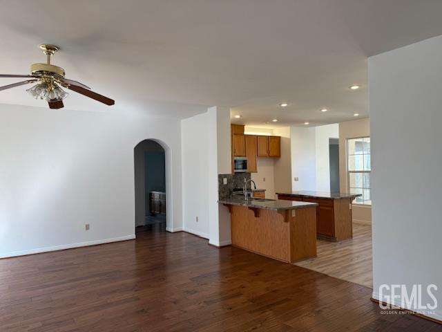 Undisclosed Address Bakersfield, CA 93311 - Photo 12 of 16 a kitchen with stainless steel appliances granite countertop a refrigerator a stove and a sink