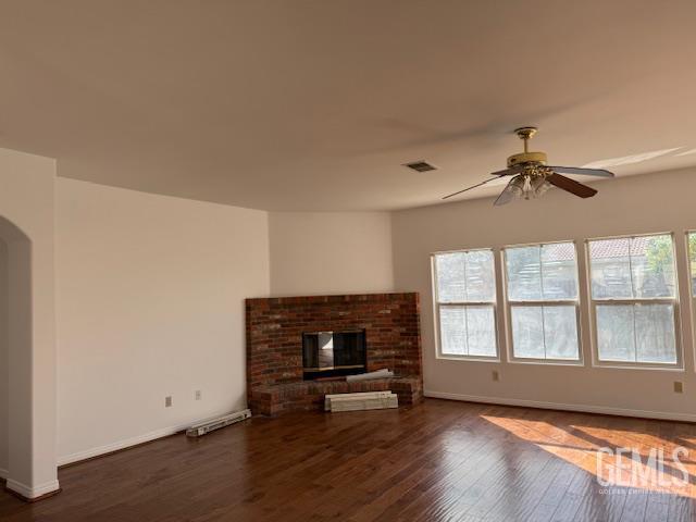 Undisclosed Address Bakersfield, CA 93311 - Photo 13 of 16 an empty room with windows and fireplace