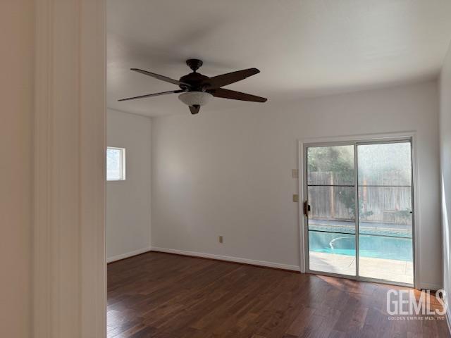 Undisclosed Address Bakersfield, CA 93311 - Photo 14 of 16 an empty room with wooden floor and windows