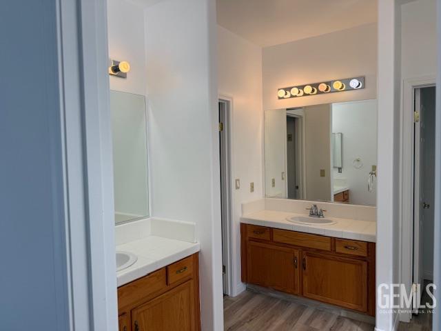 Undisclosed Address Bakersfield, CA 93311 - Photo 15 of 16 a en suite bathroom with a sink double vanity and mirror