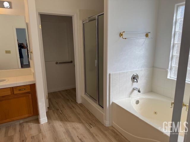 Undisclosed Address Bakersfield, CA 93311 - Photo 16 of 16 a bathroom with a bathtub and a shower