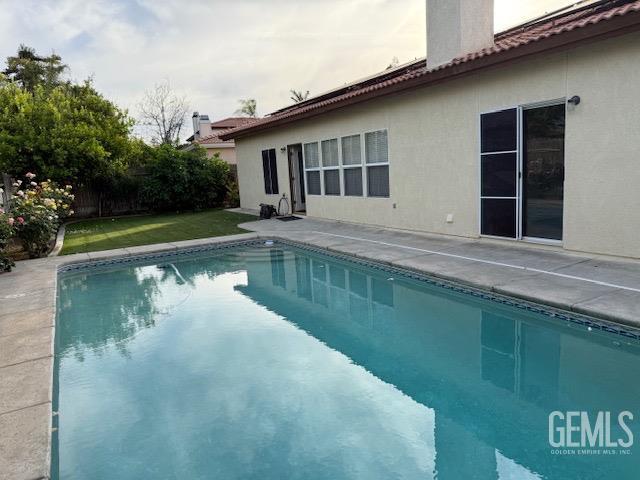 Undisclosed Address Bakersfield, CA 93311 - Photo 5 of 16 a view of a house with a swimming pool